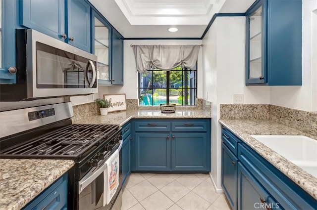 20122 Bayfront Ln Unit 102, Huntington Beach, CA 92646 - kitchen featuring appliances with stainless steel finishes, blue cabinetry, recessed lighting, and crown molding