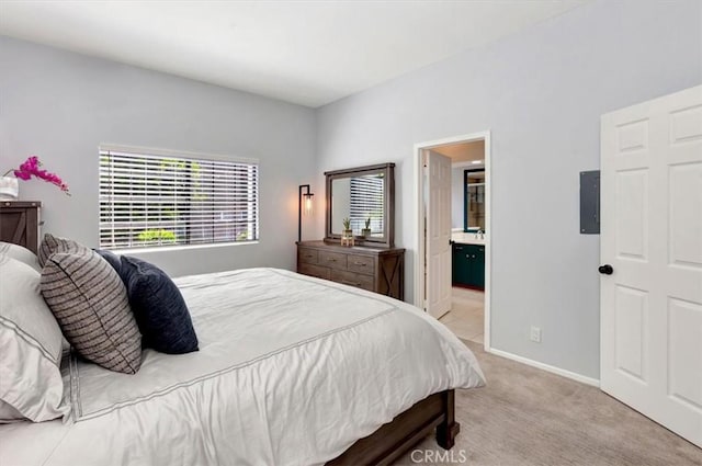 20122 Bayfront Ln Unit 102, Huntington Beach, CA 92646 - carpeted bedroom with baseboards and ensuite bath