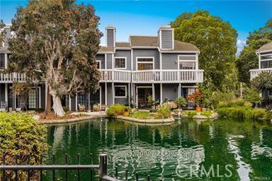 20122 Bayfront Ln Unit 102, Huntington Beach, CA 92646 - back of house featuring a water view