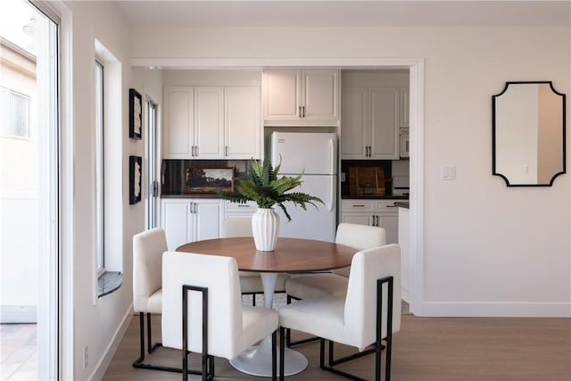 1524 Franklin St Unit C, Santa Monica, CA 90404 - dining room featuring baseboards and wood finished floors