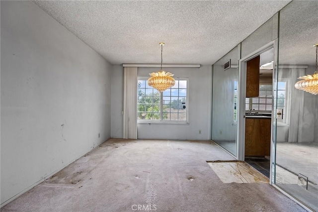 1945 Cumberland Dr, West Covina, CA 91792 - unfurnished dining area with a chandelier, carpet floors, and a textured ceiling