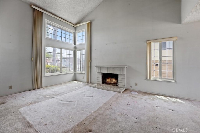 1945 Cumberland Dr, West Covina, CA 91792 - unfurnished living room with carpet, high vaulted ceiling, a brick fireplace, and a textured ceiling