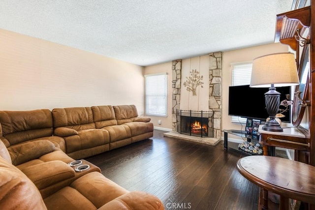 4734 E Tanglewood Ave, Anaheim, CA 92807 - living area featuring a textured ceiling, a fireplace, and wood-type flooring