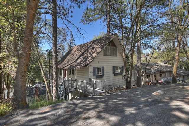 27476 School Rd, Lake Arrowhead, CA 92326 - view of front of house with driveway and roof with shingles