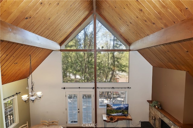 27476 School Rd, Lake Arrowhead, CA 92326 - detailed view of a chandelier and wooden ceiling with exposed beams
