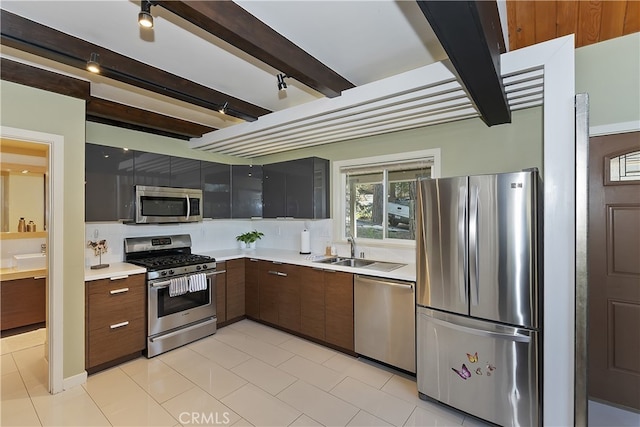 27476 School Rd, Lake Arrowhead, CA 92326 - kitchen with appliances with stainless steel finishes, a sink, light countertops, beamed ceiling, and tasteful backsplash