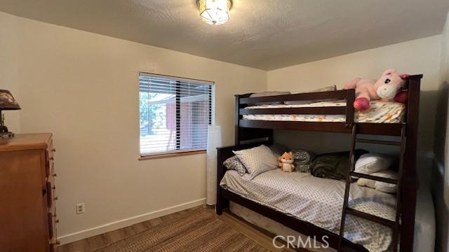 33477 Fern Dr, Green Valley Lake, CA 92341 - bedroom featuring baseboards
