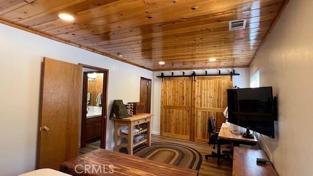33477 Fern Dr, Green Valley Lake, CA 92341 - office featuring wooden ceiling, wood finished floors, and a barn door