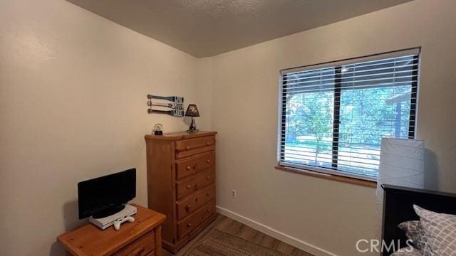 33477 Fern Dr, Green Valley Lake, CA 92341 - living area with baseboards and dark wood finished floors