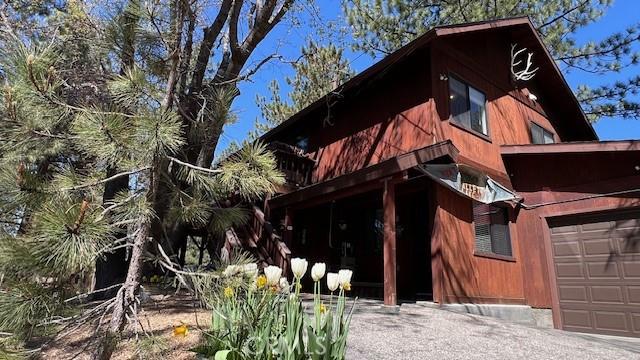 33477 Fern Dr, Green Valley Lake, CA 92341 - view of side of home with a garage