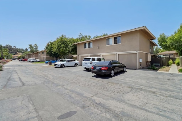 951 Amistad Ct Unit C, El Cajon, CA 92019 - view of front of property featuring stucco siding and an attached garage