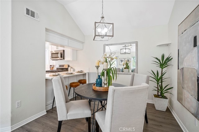 28241 Sorrento Unit 124, Laguna Niguel, CA 92677 - dining area with vaulted ceiling, a chandelier, dark wood finished floors, and baseboards