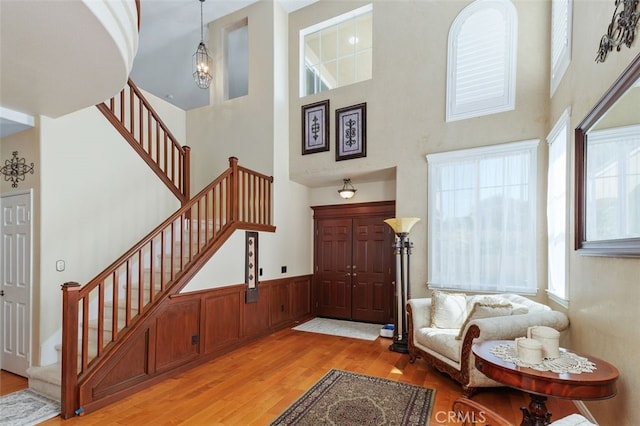 29944 Peach Tree Ct, Murrieta, CA 92563 - foyer entrance with a high ceiling, stairs, and light wood-style flooring