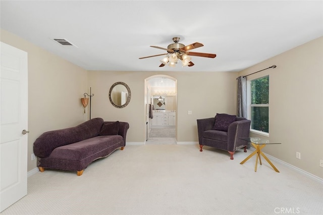 29944 Peach Tree Ct, Murrieta, CA 92563 - living area with carpet floors, ceiling fan, arched walkways, and baseboards