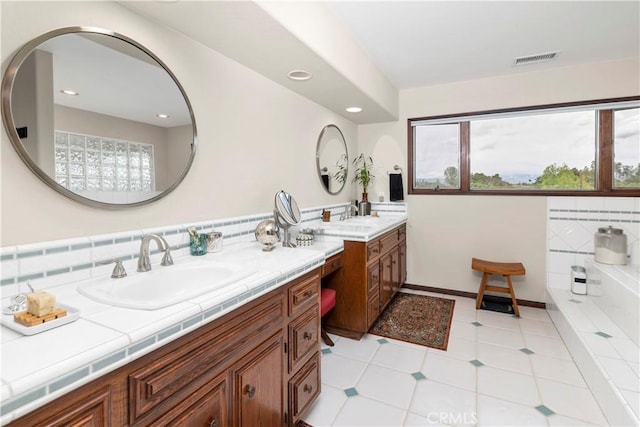 735 Del Valle Dr, Fallbrook, CA 92028 - bathroom with vanity, healthy amount of natural light, tile patterned flooring, a bath, and recessed lighting
