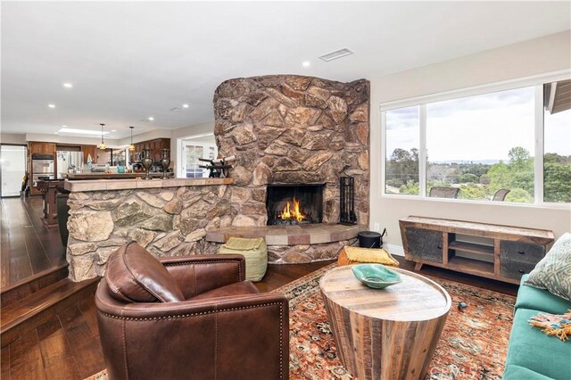 735 Del Valle Dr, Fallbrook, CA 92028 - living room featuring dark wood finished floors, a fireplace, and recessed lighting