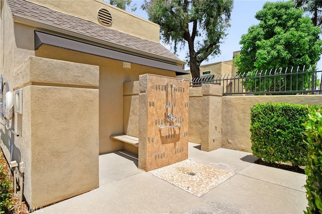 27906 Amber Unit 231, Mission Viejo, CA 92691 - view of home's exterior featuring stucco siding and roof with shingles