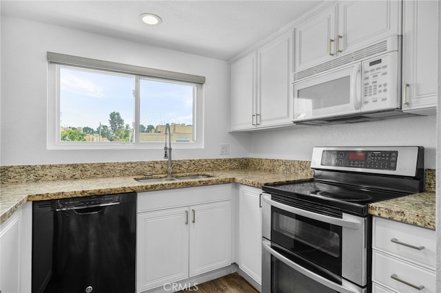27906 Amber Unit 231, Mission Viejo, CA 92691 - kitchen with white microwave, dishwasher, double oven range, a sink, and white cabinetry