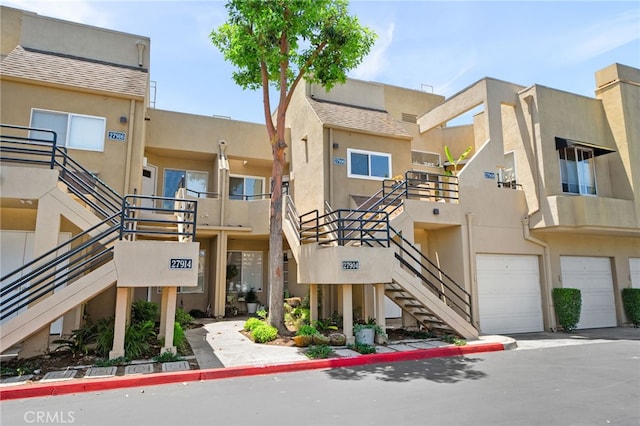 27906 Amber Unit 231, Mission Viejo, CA 92691 - view of building exterior featuring stairs and a garage