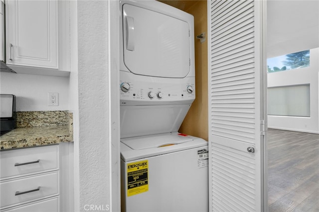 27906 Amber Unit 231, Mission Viejo, CA 92691 - laundry area with stacked washer / dryer and wood finished floors