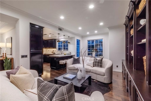 14 Saint Pierre, Newport Coast, CA 92657 - living room featuring dark wood-style flooring, ornamental molding, and recessed lighting