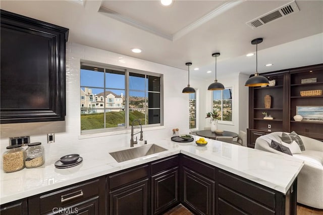 14 Saint Pierre, Newport Coast, CA 92657 - kitchen with a sink, a peninsula, recessed lighting, pendant lighting, and tasteful backsplash