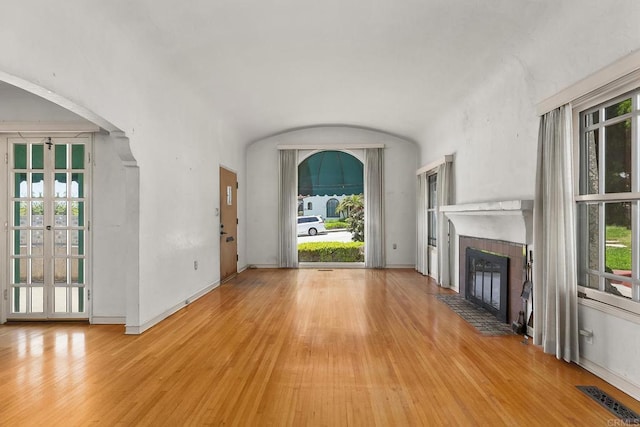 3120 Curtis St, San Diego, CA 92106 - unfurnished living room with wood finished floors, a fireplace, healthy amount of natural light, and baseboards