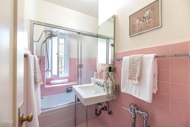 80 N Euclid Ave Unit 102, Pasadena, CA 91101 - full bathroom featuring tile walls, combined bath / shower with glass door, a sink, and wainscoting