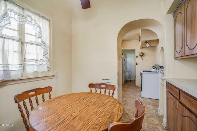 1120 S Burnside Ave, Los Angeles, CA 90019 - dining space with arched walkways and stone finish flooring