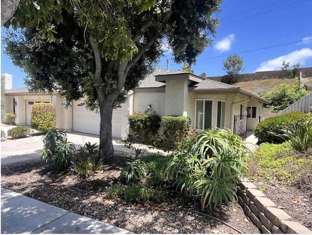 3536 Sky Haven Ln, Oceanside, CA 92056 - view of front of house with stucco siding, an attached garage, and concrete driveway