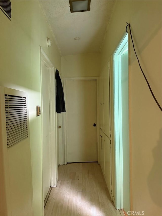 12406 Haley St, Sun Valley, CA 91352 - hall with a heating unit and light wood-style flooring