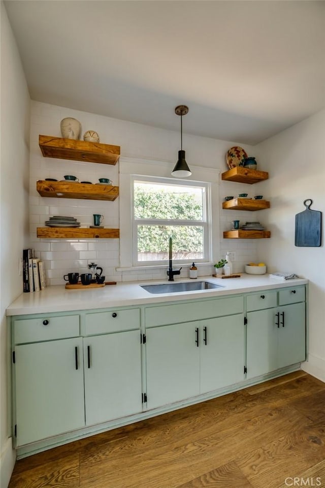 3716 Rosemead Ave, Los Angeles, CA 90032 - kitchen featuring a sink, open shelves, decorative backsplash, and wood finished floors