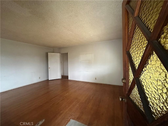 863 S Vanhorn Ave N, West Covina, CA 91790 - unfurnished room featuring wood finished floors and a textured ceiling
