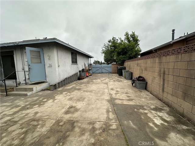 863 S Vanhorn Ave N, West Covina, CA 91790 - view of home's exterior featuring a gate, a patio area, and stucco siding