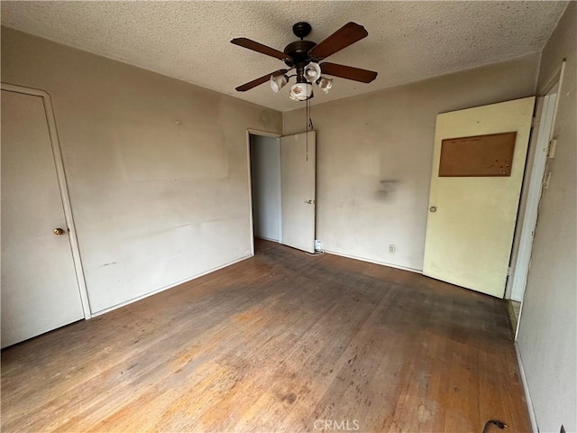 863 S Vanhorn Ave N, West Covina, CA 91790 - unfurnished bedroom with wood finished floors, a textured ceiling, ceiling fan, and baseboards