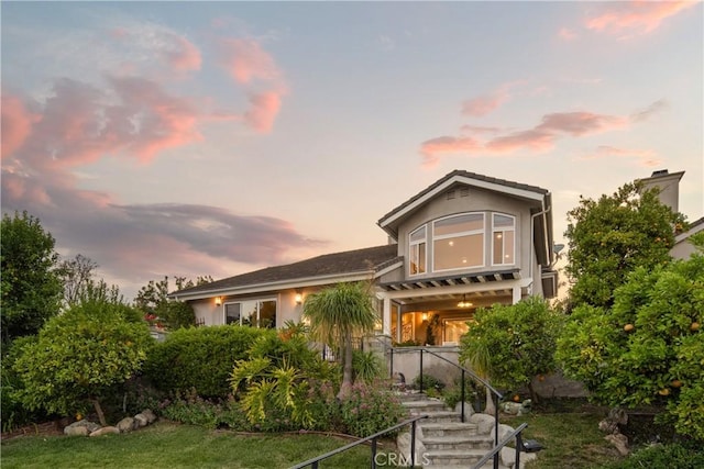 2567 Oakshore, Westlake Village, CA 91361 - back of property at dusk with a chimney and a pergola