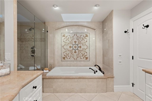 2567 Oakshore, Westlake Village, CA 91361 - full bathroom with vanity, a bath, a skylight, tile patterned flooring, and a tile shower