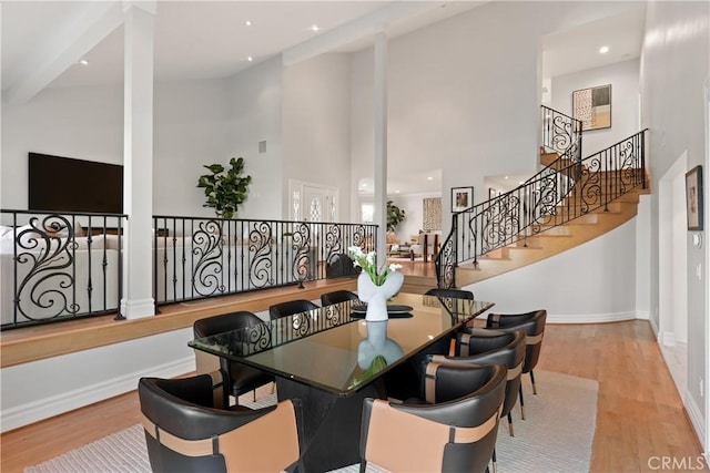 2567 Oakshore, Westlake Village, CA 91361 - dining room with a high ceiling, wood finished floors, baseboards, recessed lighting, and stairway