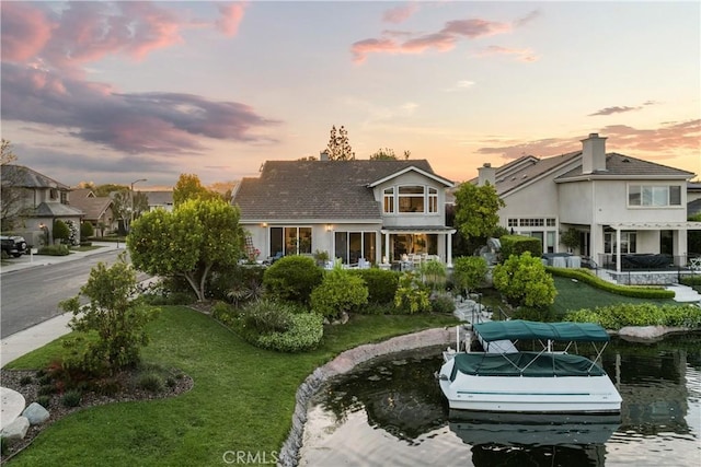 2567 Oakshore, Westlake Village, CA 91361 - view of front facade with a boat dock and a front yard