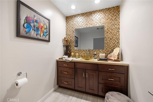 1361 Winchester Ave, Glendale, CA 91201 - bathroom with vanity, baseboards, recessed lighting, and decorative backsplash