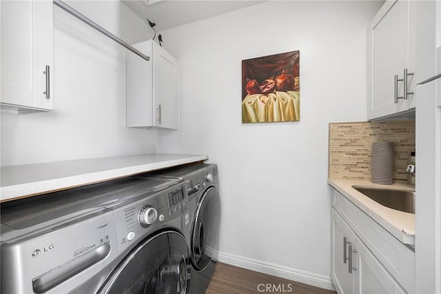 1361 Winchester Ave, Glendale, CA 91201 - laundry room featuring washer and clothes dryer, baseboards, cabinet space, and wood finished floors