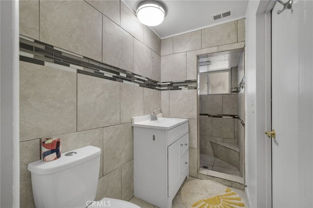 31189 Alta Vista Dr, Redlands, CA 92373 - full bathroom with vanity, toilet, tile walls, and a stall shower