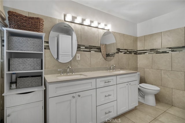 31189 Alta Vista Dr, Redlands, CA 92373 - bathroom featuring tile walls, double vanity, tile patterned flooring, toilet, and tasteful backsplash