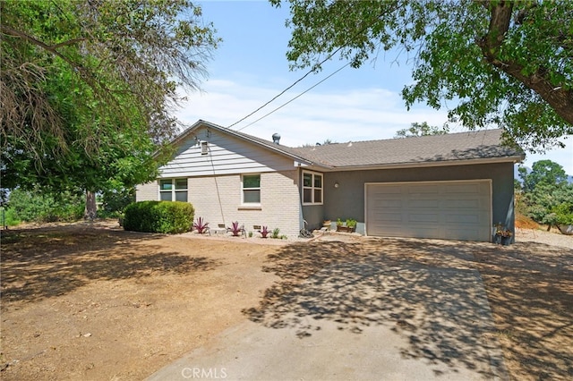 31189 Alta Vista Dr, Redlands, CA 92373 - single story home featuring dirt driveway, an attached garage, and brick siding