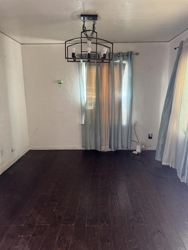 698 J St, Chula Vista, CA 91910 - unfurnished dining area featuring hardwood / wood-style flooring, baseboards, and a chandelier