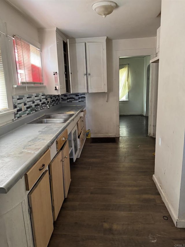698 J St, Chula Vista, CA 91910 - kitchen with dark wood-type flooring, a sink, baseboards, and light countertops