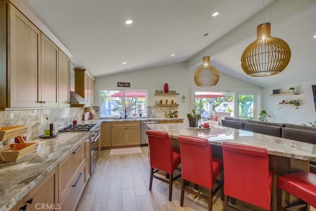 9171 Heatherton Cir, Huntington Beach, CA 92646 - kitchen featuring stainless steel appliances, decorative backsplash, healthy amount of natural light, a breakfast bar, and recessed lighting