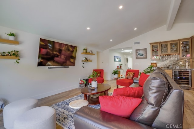 9171 Heatherton Cir, Huntington Beach, CA 92646 - living room featuring wine cooler, a bar, light wood-style flooring, baseboards, and recessed lighting