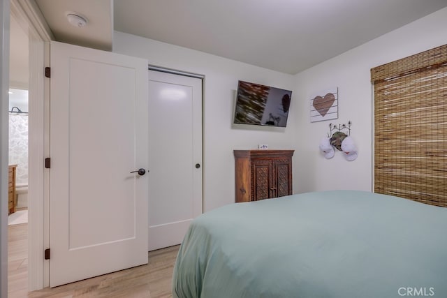 9171 Heatherton Cir, Huntington Beach, CA 92646 - bedroom with light wood-style flooring and a closet