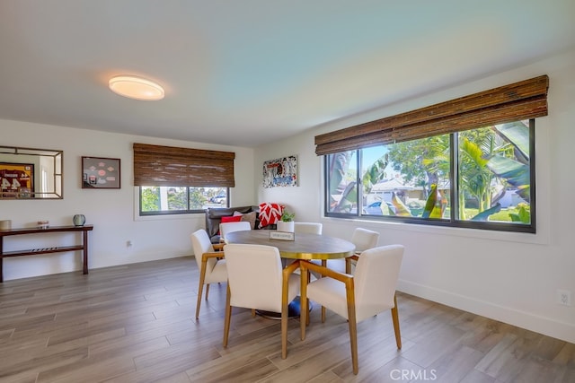 9171 Heatherton Cir, Huntington Beach, CA 92646 - dining room with light wood-type flooring and baseboards